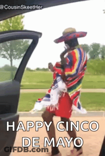 A Man Wearing A Sombrero And A Poncho Is Dancing In Front Of A Car . GIF