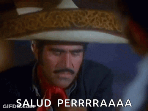 A Man Wearing A Sombrero Is Drinking A Glass Of Water And Says Salud Perrraaaa . GIF