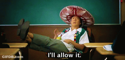 A Man Wearing A Sombrero Sits In A Classroom With The Words " I 'Ll Allow It " Below Him GIF