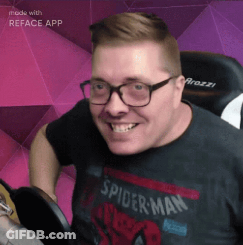 A Man Wearing A Spider-Man Shirt Is Smiling GIF