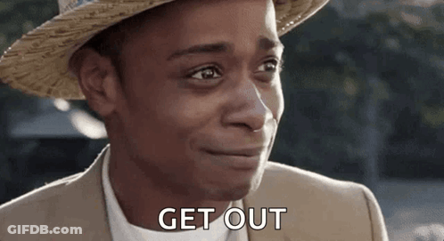 A Man Wearing A Straw Hat And A Suit Is Smiling And Saying `` Get Out '' . GIF