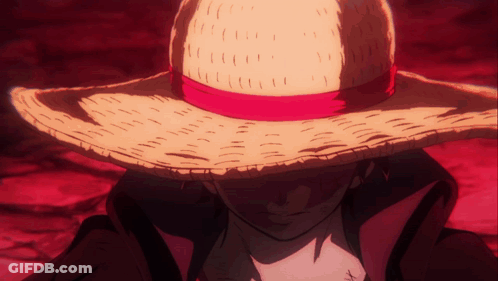 A Man Wearing A Straw Hat With A Red Ribbon Around It GIF