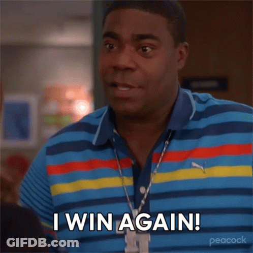 A Man Wearing A Striped Shirt And A Necklace Says I Win Again GIF