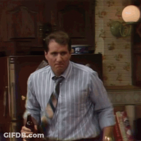 Man In Striped Shirt Holding Beer GIF