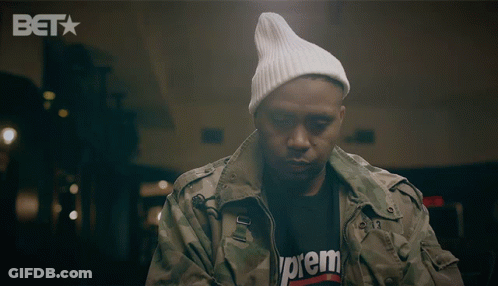 A Man Wearing A Supreme T-Shirt And A White Beanie GIF
