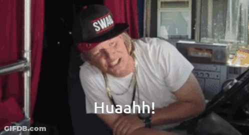 A Man Wearing A Swag Hat And A White Shirt Says Huaahh GIF
