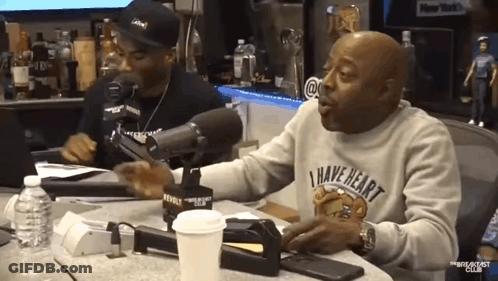 A Man Wearing A Sweater That Says " I Have Heart " GIF