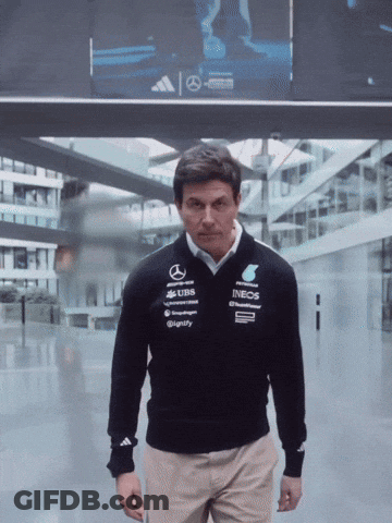 A Man Wearing A Sweater That Says Ineos On The Front GIF