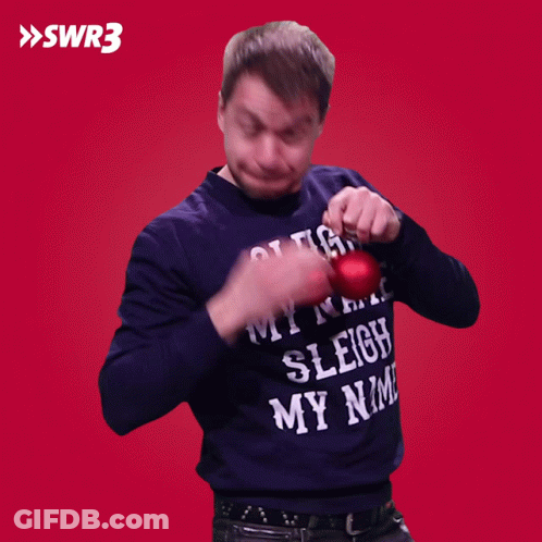 A Man Wearing A Sweater That Says " Sleigh My Name " GIF