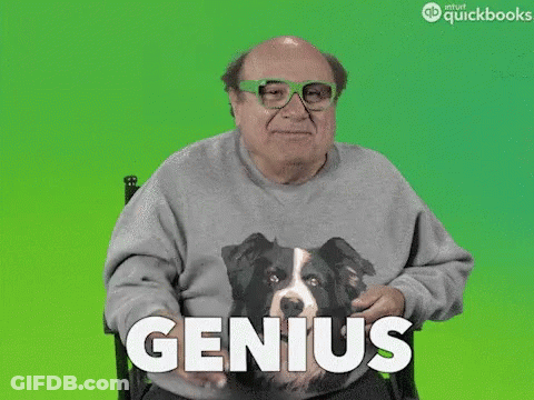 A Man Wearing A Sweater With A Dog On It And The Word Genius GIF