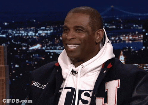 A Man Wearing A Sweatshirt That Says Believe On It GIF