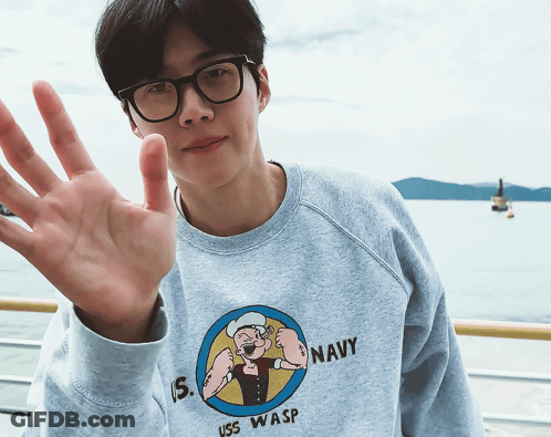 A Man Wearing A Sweatshirt That Says Uss Wasp GIF