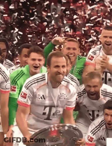 A Man Wearing A T-Mobile Jersey Holds A Trophy GIF
