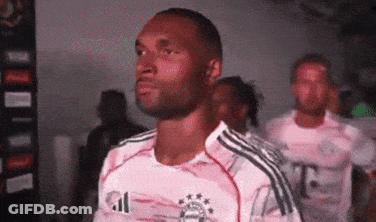 A Man Wearing A T-Mobile Jersey Stands In A Line With Other Men GIF