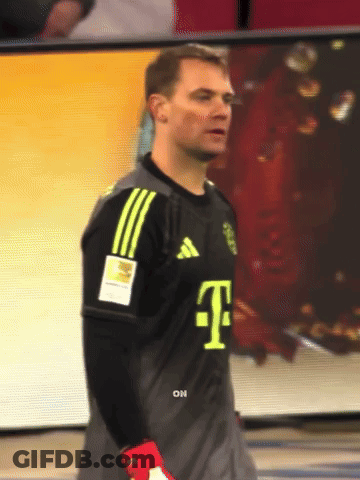 A Man Wearing A T-Mobile Jersey Stands In Front Of A Screen GIF