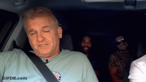 A Man Wearing A T-Shirt That Says ' American ' On It GIF