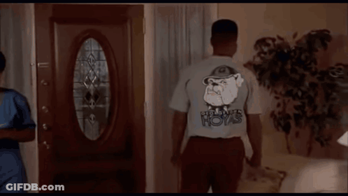 A Man Wearing A T-Shirt That Says Boys On The Back GIF