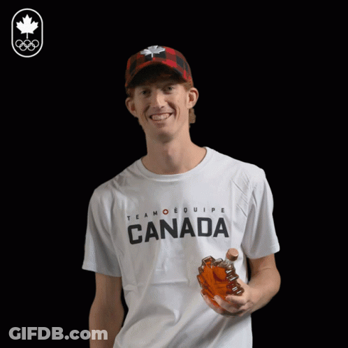 A Man Wearing A T-Shirt That Says Canada Drinks From A Bottle GIF