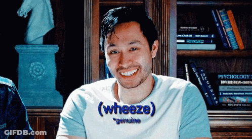 A Man Wearing A T-Shirt That Says " Genuine " On It GIF