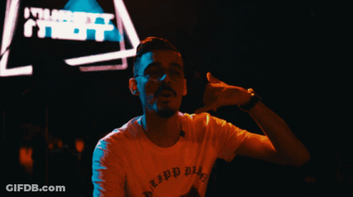 A Man Wearing A T-Shirt That Says ' Lipp Bitch ' On It GIF