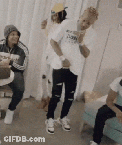 A Man Wearing A T-Shirt That Says Loud Is Dancing In A Room GIF