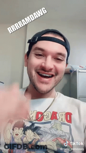 A Man Wearing A T-Shirt That Says ' Rrrramdawg ' On It GIF