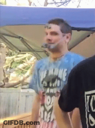 A Man Wearing A T-Shirt That Says The Name Of The Game Is Free GIF