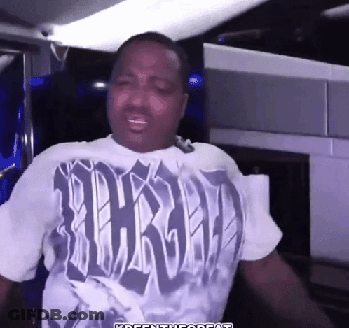 A Man Wearing A T-Shirt That Says Thrashed On It GIF
