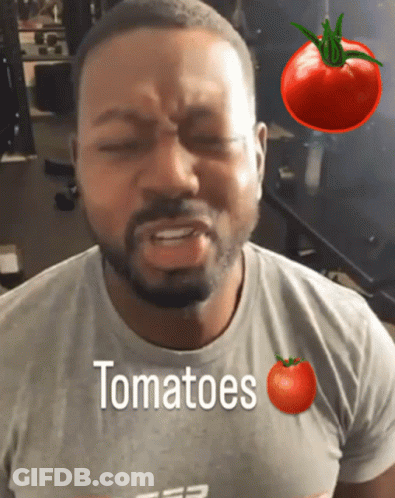 A Man Wearing A T-Shirt That Says Tomatoes On It GIF