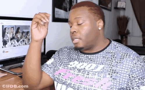 A Man Wearing A T-Shirt That Says Victoria 'S Secret On It GIF
