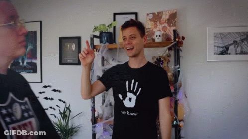 A Man Wearing A T-Shirt That Says We Know GIF