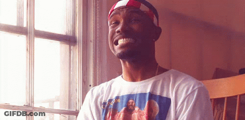 A Man Wearing A T-Shirt With A Picture Of Jesus On It Is Smiling GIF