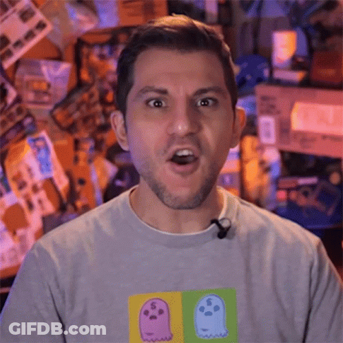A Man Wearing A T-Shirt With Ghosts On It GIF