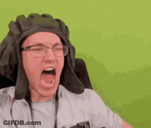 A Man Wearing A Tank Hat And Glasses Is Screaming . GIF