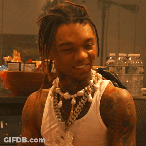 A Man Wearing A Tank Top And A Pearl Necklace GIF
