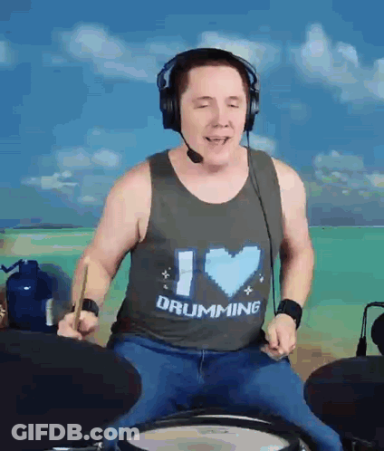 A Man Wearing A Tank Top That Says I Love Drumming GIF