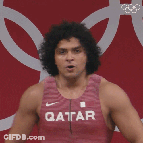 A Man Wearing A Tank Top That Says Qatar GIF