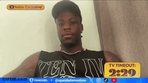 A Man Wearing A Tank Top That Says Ten Iv On It GIF