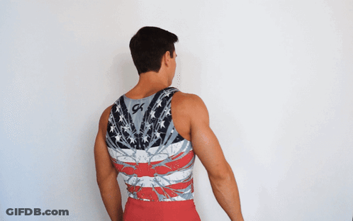 A Man Wearing A Tank Top With The Word Usa On It GIF