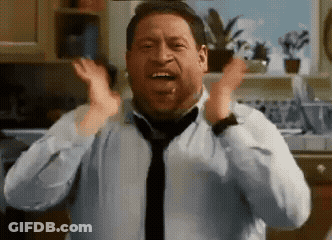 A Man Wearing A Tie And A White Shirt Is Screaming In A Kitchen GIF