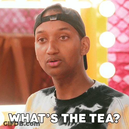 A Man Wearing A Tie Dye Shirt And A Baseball Cap Says " What 'S The Tea " GIF