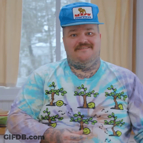 A Man Wearing A Tie Dye Shirt And A Blue Hat Says That Was A Lot GIF