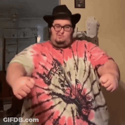 A Man Wearing A Tie Dye Shirt And A Cowboy Hat Is Dancing GIF