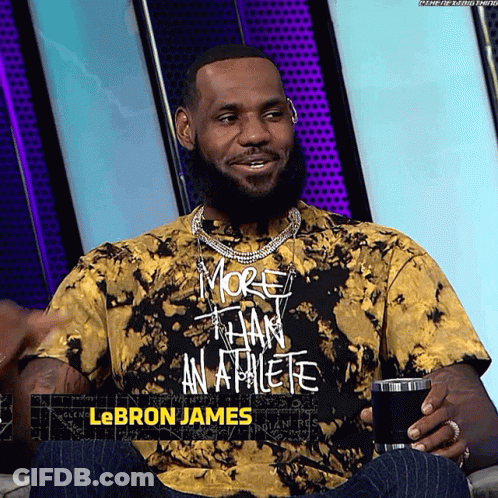 A Man Wearing A Tie Dye T-Shirt That Says More Than An Athlete GIF