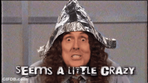 A Man Wearing A Tin Foil Hat With The Words Seems A Little Crazy GIF