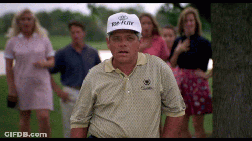 A Man Wearing A Top-Flite Hat Stands In Front Of A Group Of People GIF
