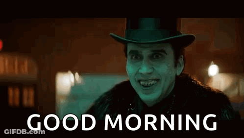 A Man Wearing A Top Hat And A Fur Coat Is Smiling And Says `` Good Morning '' . GIF