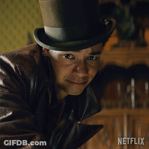 A Man Wearing A Top Hat And A Leather Jacket With A Netflix Logo In The Corner GIF