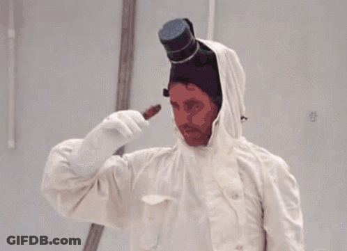 A Man Wearing A Top Hat And A White Coat GIF