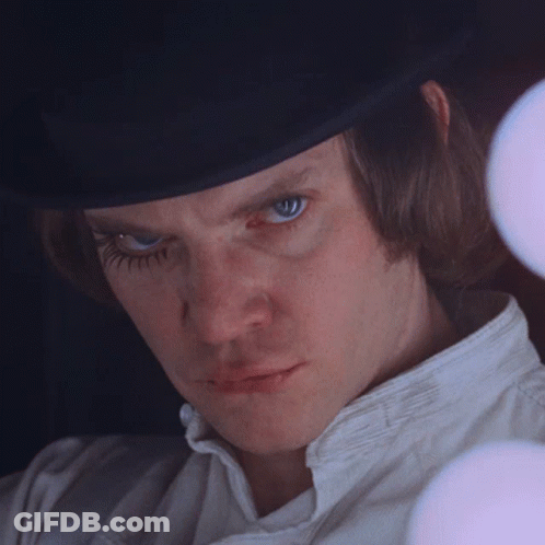 A Man Wearing A Top Hat And A White Shirt GIF